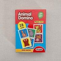 Animal Domino game box with colourful illustrations on a grey background