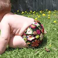 Reusable cloth nappy on a child in the sunshine