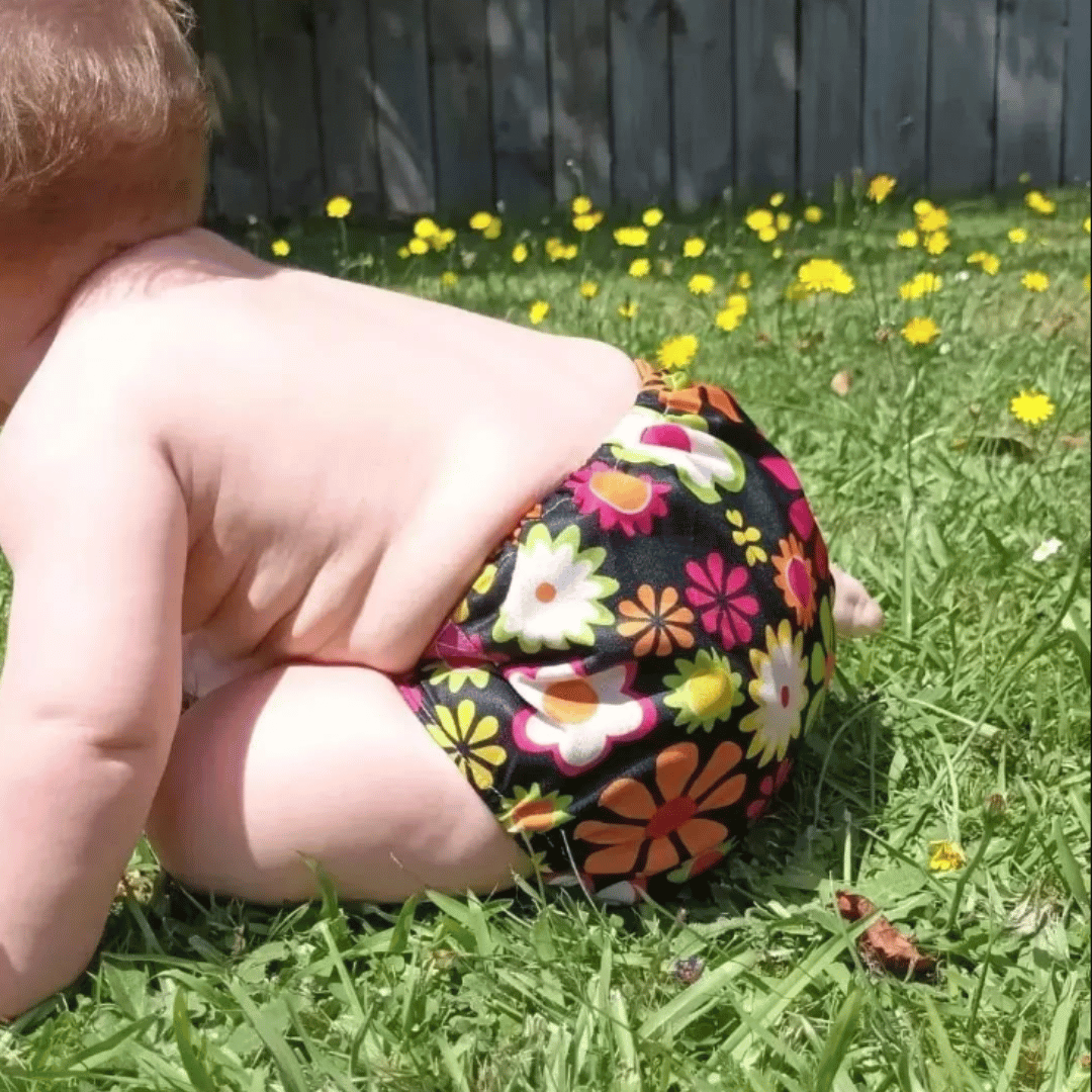 Reusable cloth nappy on a child in the sunshine
