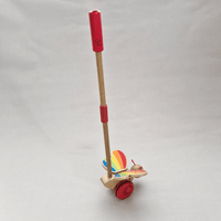 Toy with a red handle and colorful base on a white background