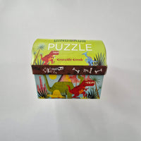 Dinosaur-themed puzzle box with colourful illustrations on a white background
