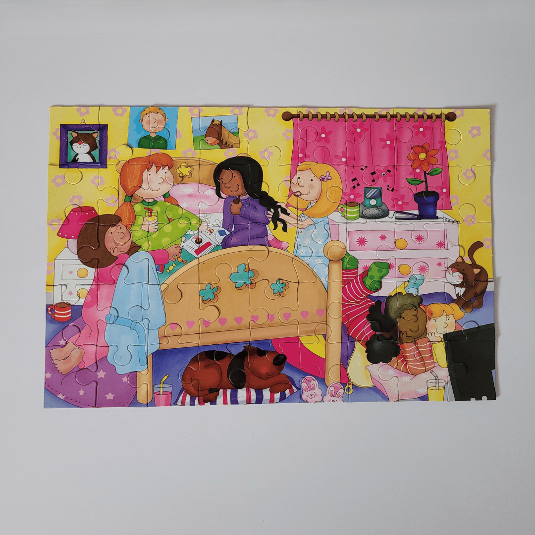 Sleep Over puzzle with a colourful scene of children playing in a bedroom.
