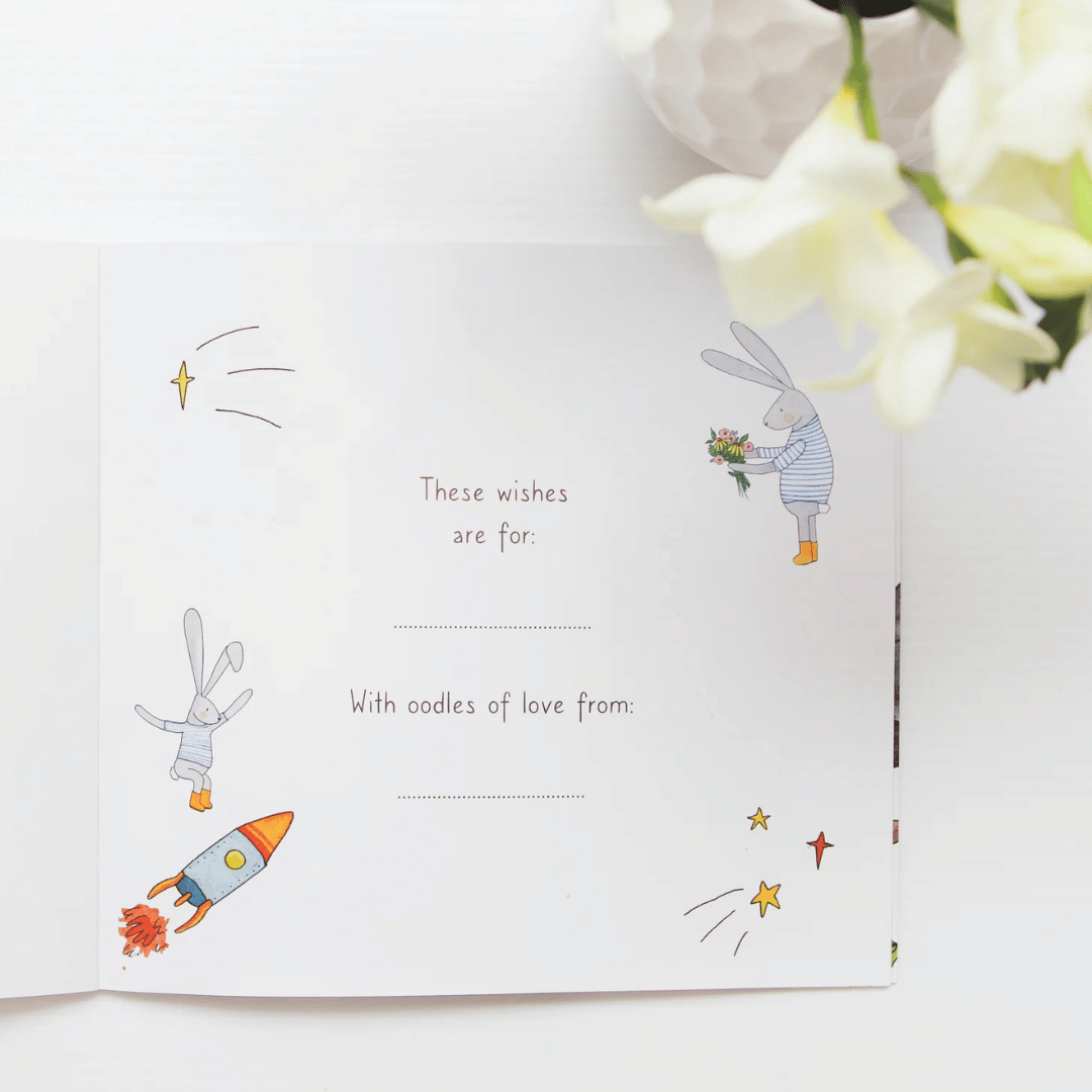 This Book belongs to page with illustrations of a rabbit and rocket, and text on a white background.