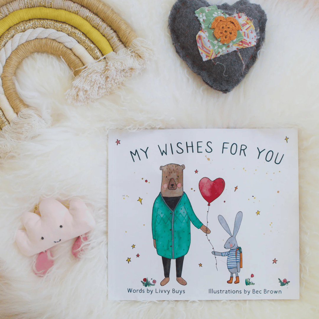 Children's book titled 'My Wishes for You' with illustrations of a bear and rabbit on a soft white background.