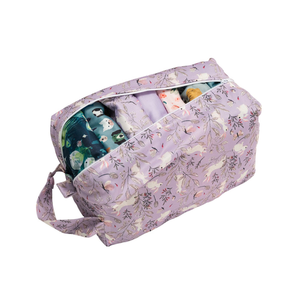 Lilac Bunnies Nappy pod with reusable nappies inside on a white background
