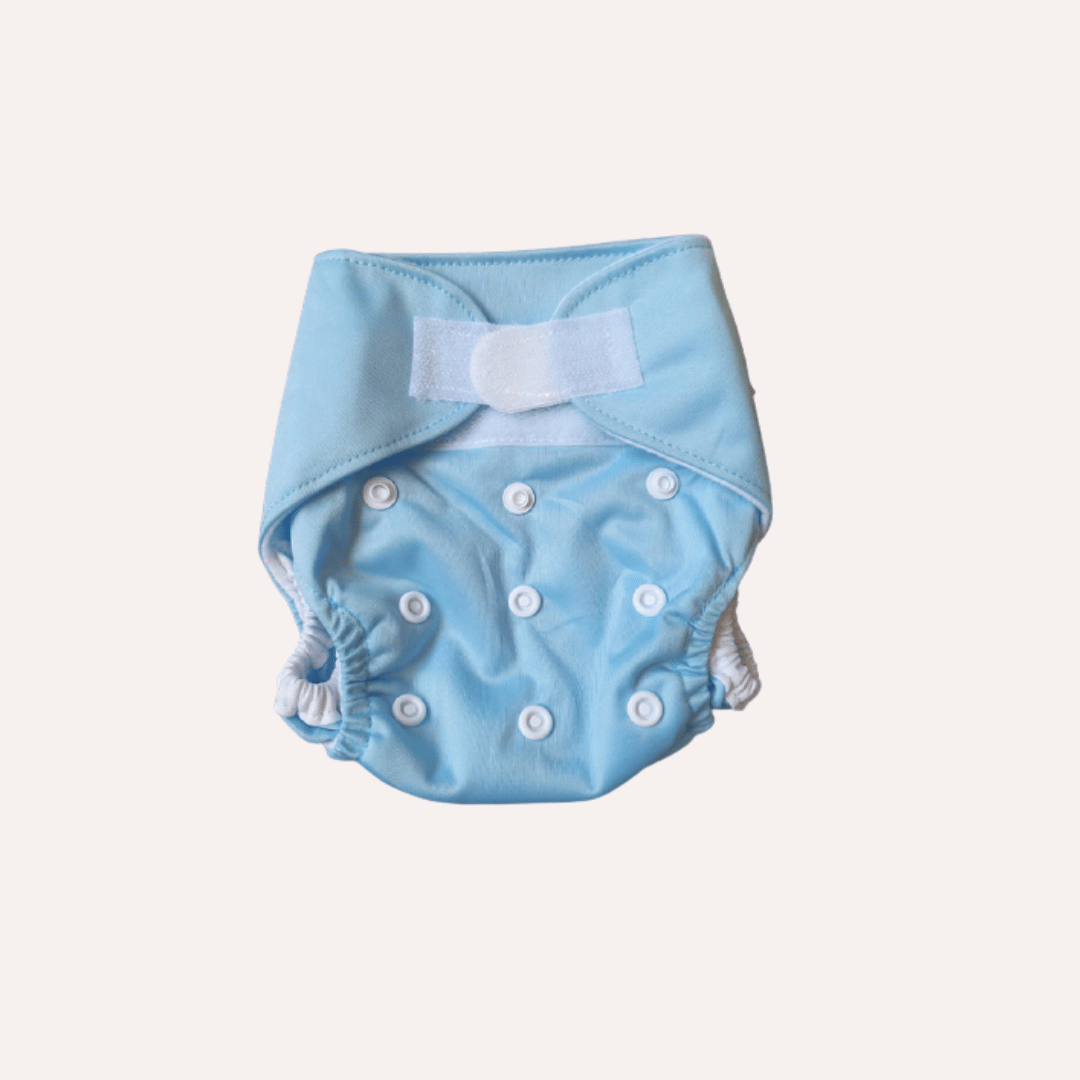 Light blue newborn reusable cloth nappy with velcro on a light grey background
