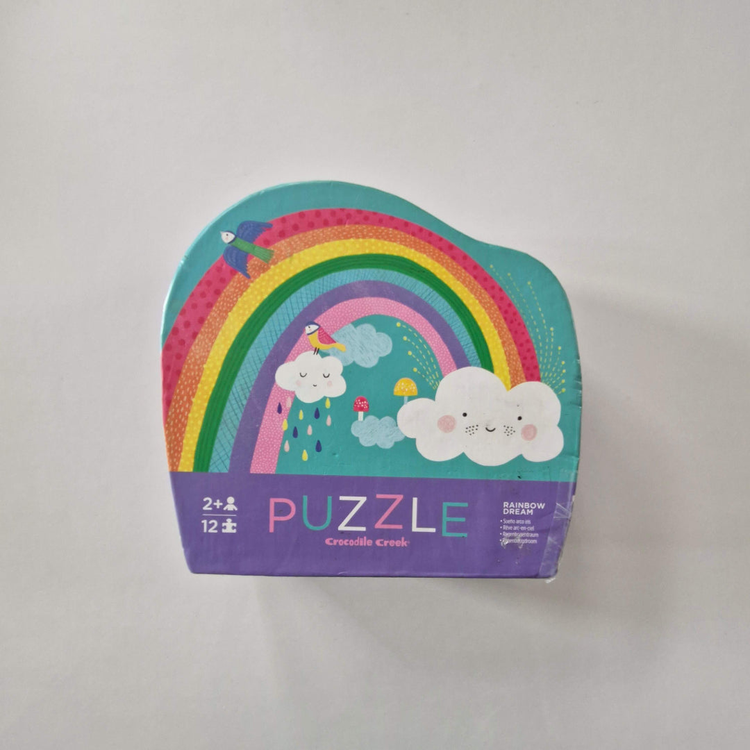 Children's puzzle box with a colourful rainbow design on a white background