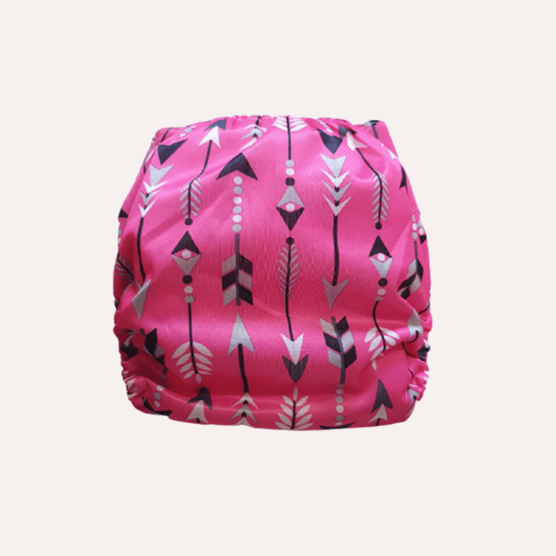 Pink reusable cloth nappy with arrow pattern on a white background