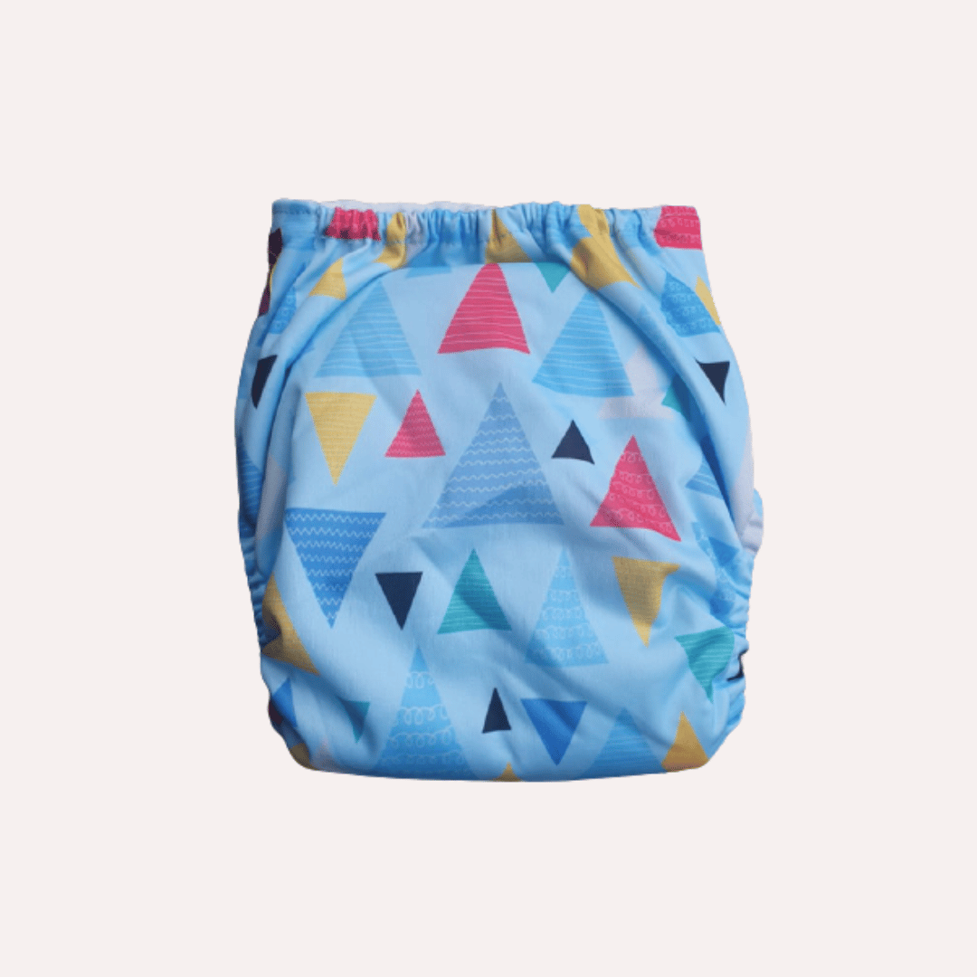 Reusable cloth nappy with colourful triangle pattern on a light blue background