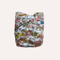 Reusable cloth nappy with colourful bird pattern on a white background