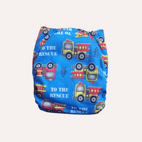 Blue reusable cloth nappy with fire truck pattern and 'To the Rescue' text on a white background