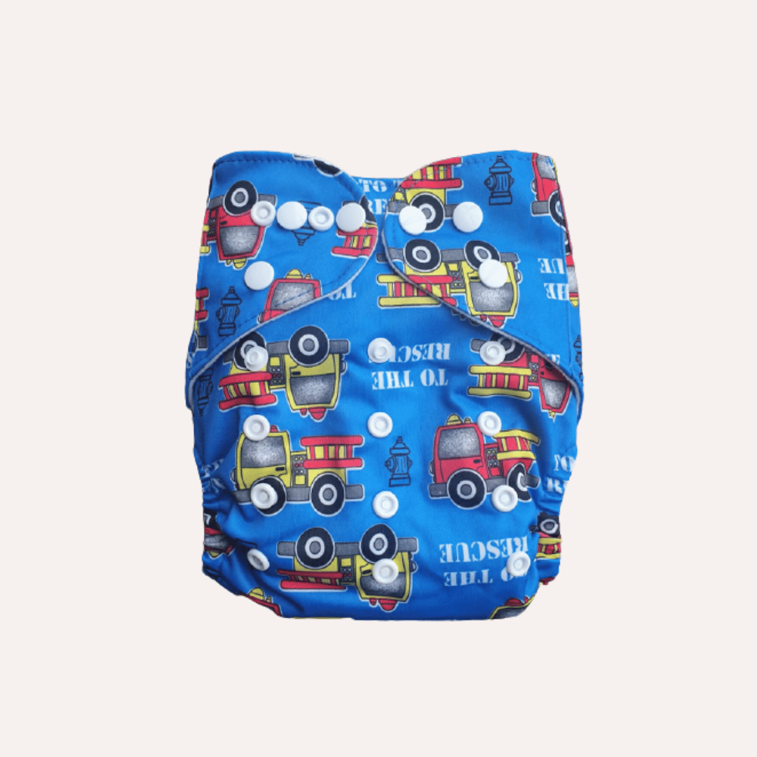 Blue reusable cloth nappy with fire truck pattern on a grey background