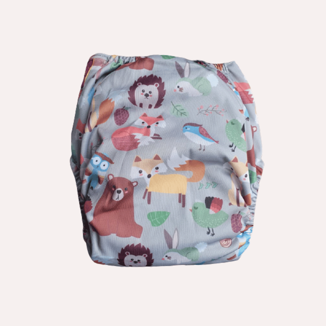 Patterned reusable cloth nappy with animal designs on a light grey background