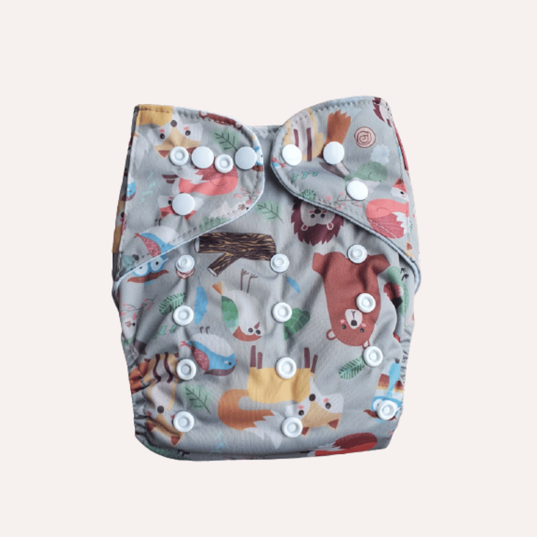 Patterned reusable cloth nappy with animal designs on a light grey background
