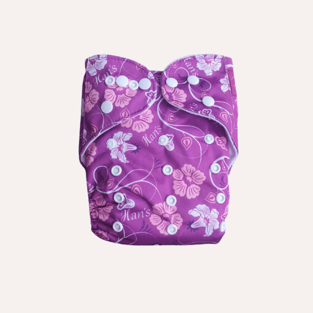 Purple reusable cloth nappy with pink floral pattern on a white background