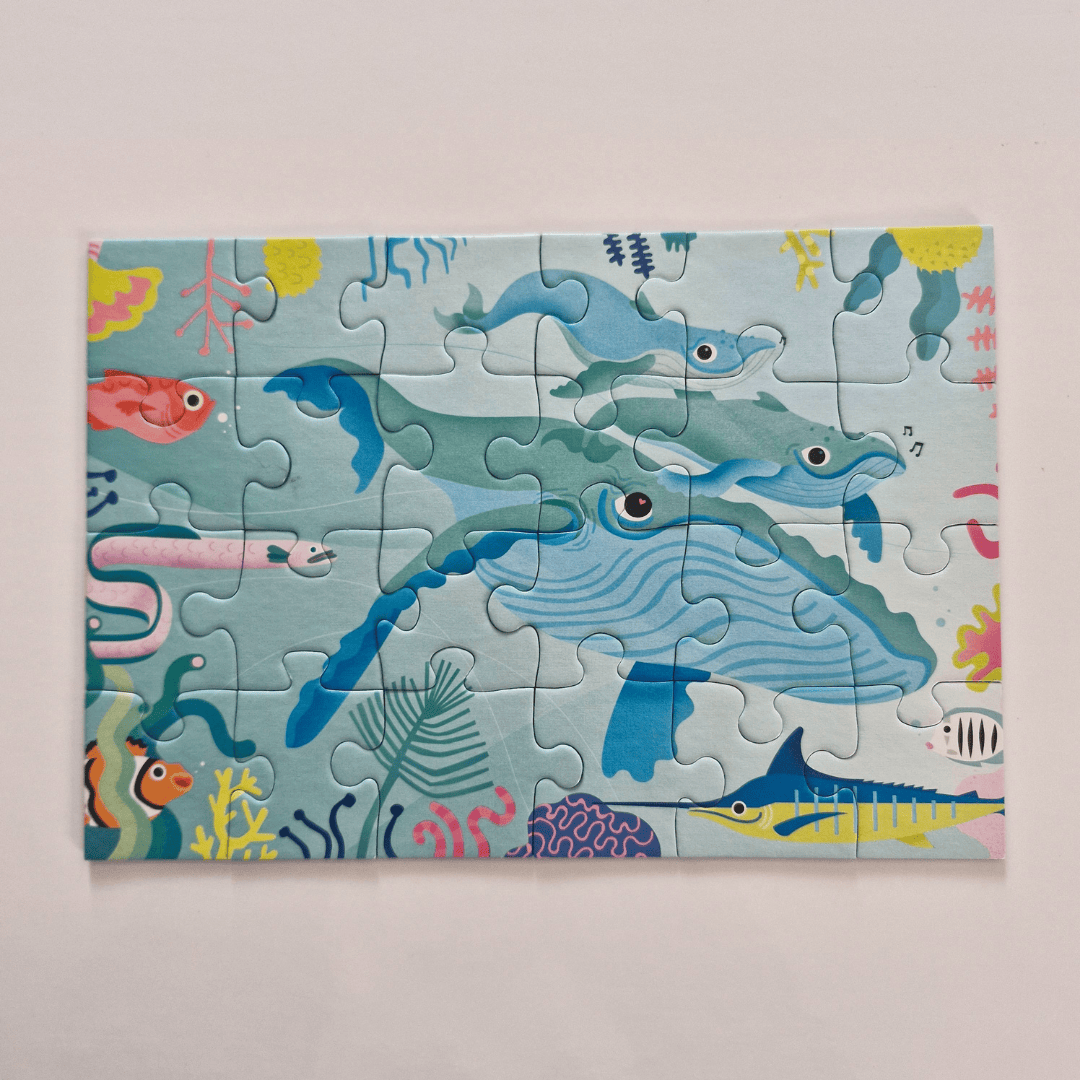 Children's puzzle with an underwater theme on a light pink background