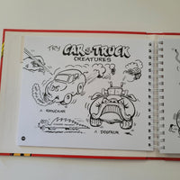 Spiral-bound drawing book with black line art on a white background