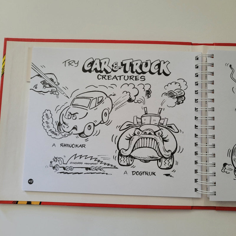 Spiral-bound drawing book with black line art on a white background