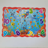 Colourful children's puzzle with sea-themed illustrations on a white background