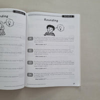 Open book with educational content on a textured surface