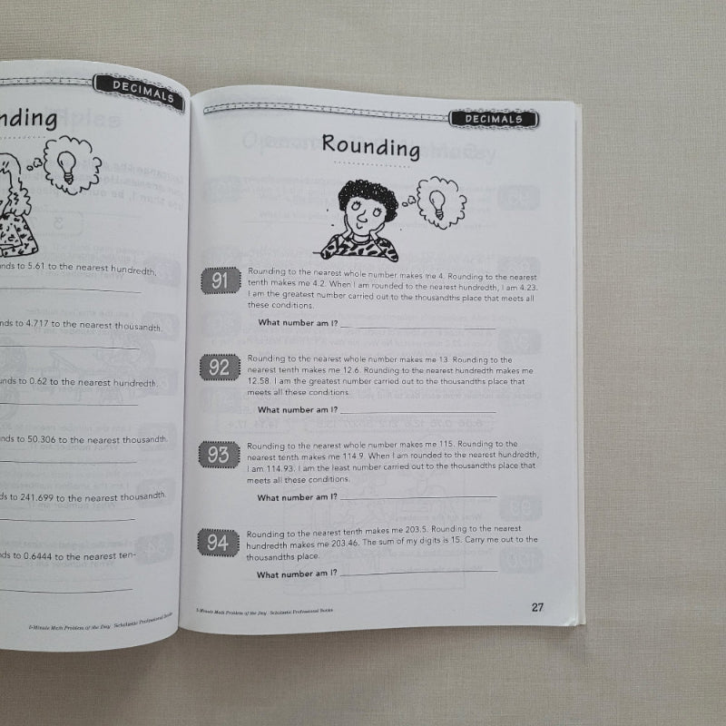 Open book with educational content on a textured surface