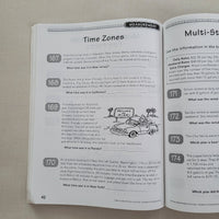 Open book with educational content on a beige surface
