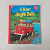 Book cover of 'A Kiwi Jingle Bells' with a red van and mountain landscape on a grey background