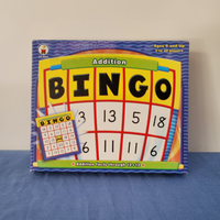Addition Bingo game packaging with visible bingo cards and numbers, designed for educational purposes.