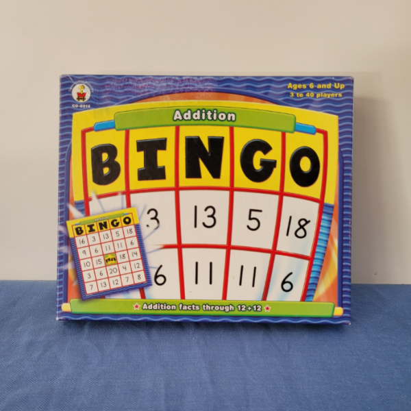 Addition Bingo game packaging with visible bingo cards and numbers, designed for educational purposes.