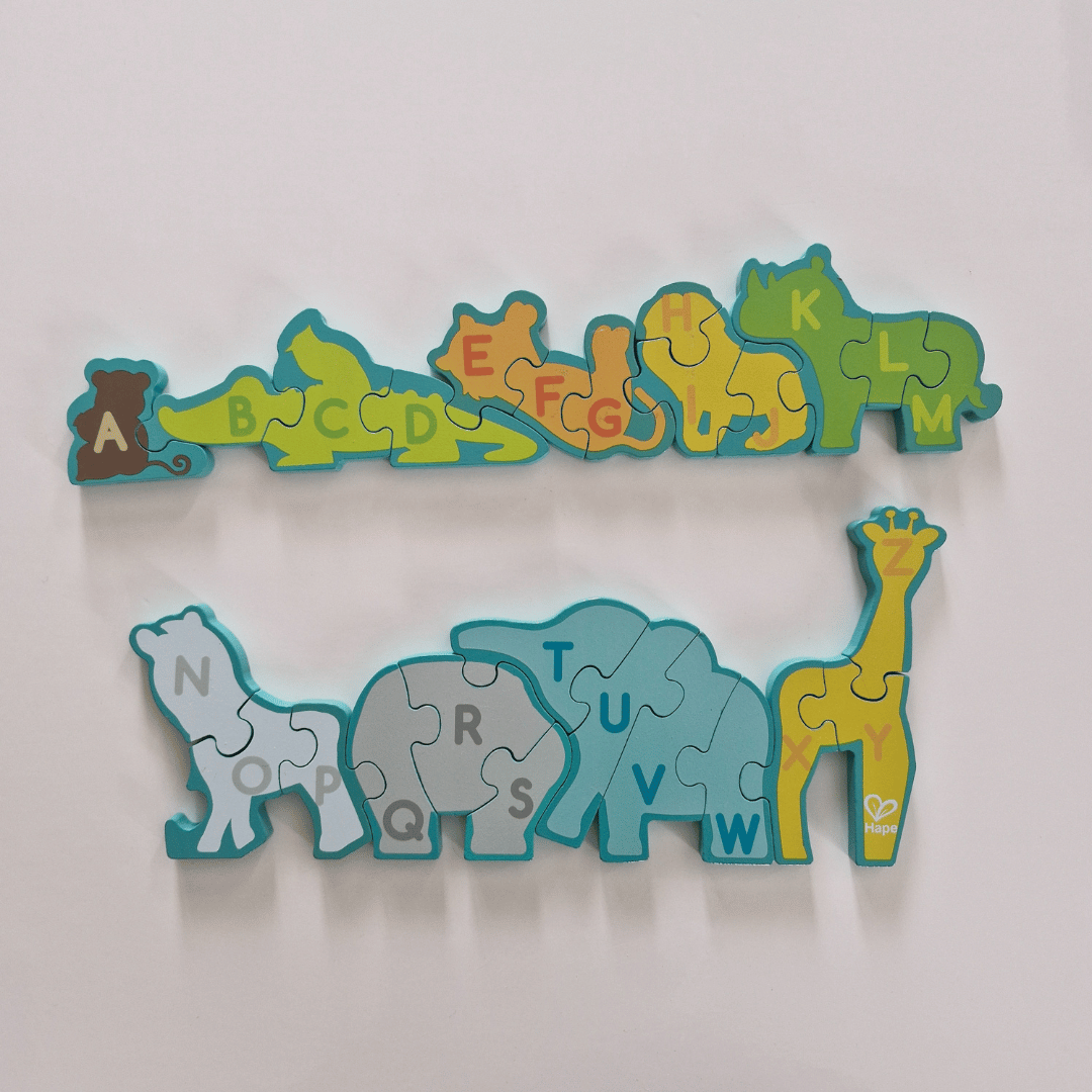 Children's alphabet puzzle with animal shapes on a white background