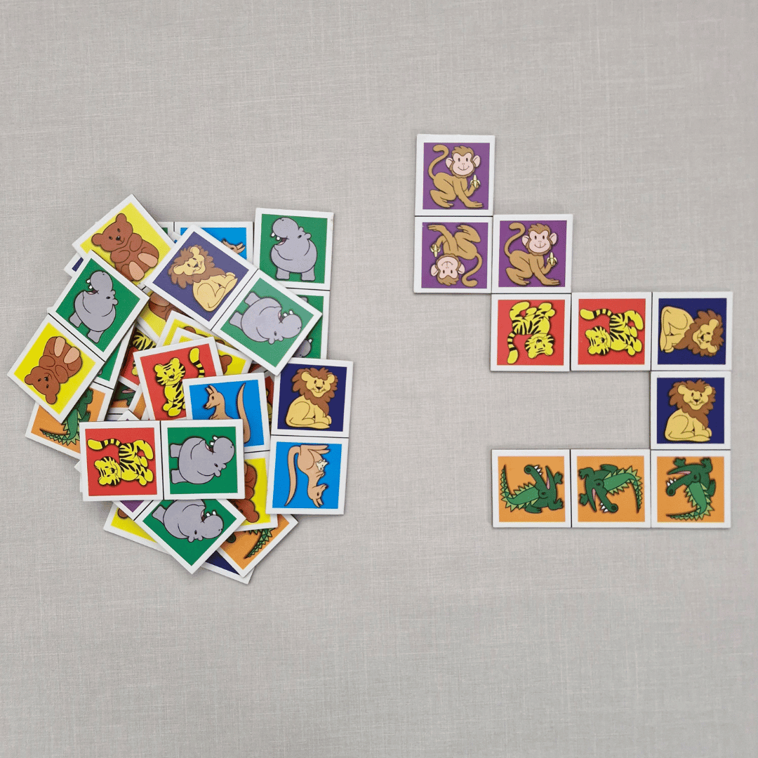 Collection of colourful animal cards on a grey surface