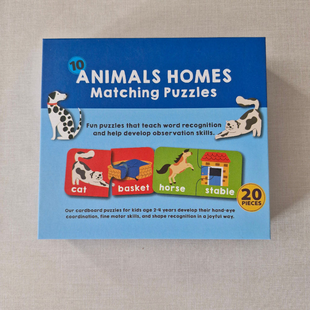 Box of '10 Animals Homes Matching Puzzles' on a textured surface