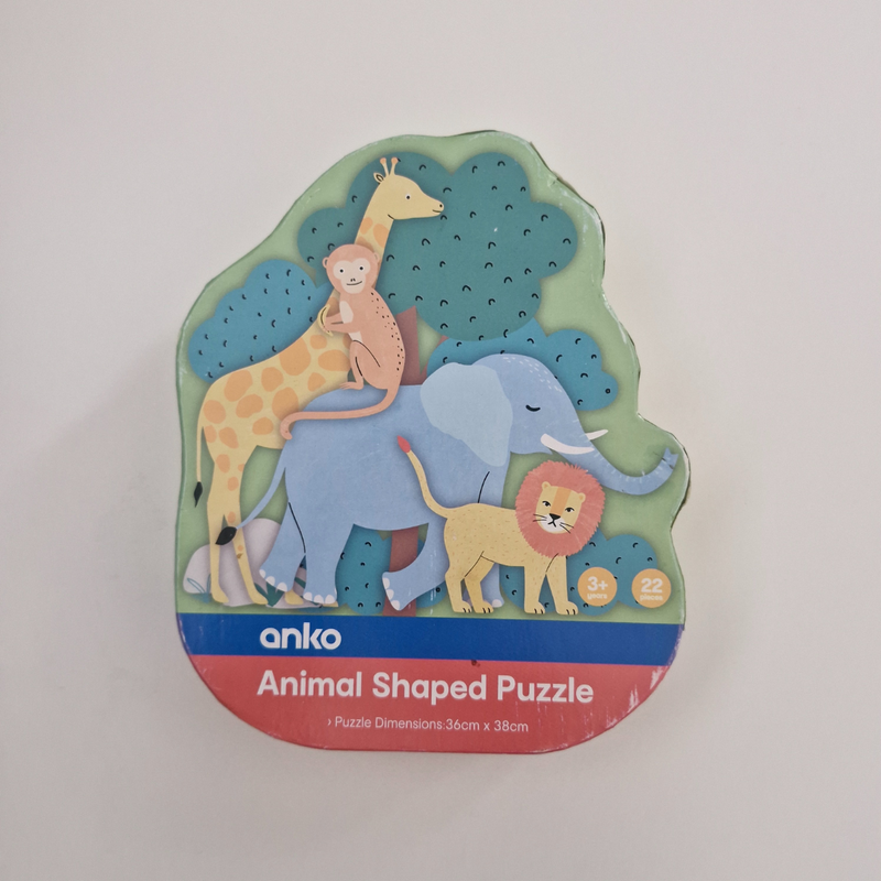 Animal shaped puzzle packaging with a giraffe, monkey, elephant, lion, and tree design on a white background.