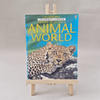 Book titled 'Animal World' by Usborne on a small easel against a light grey background