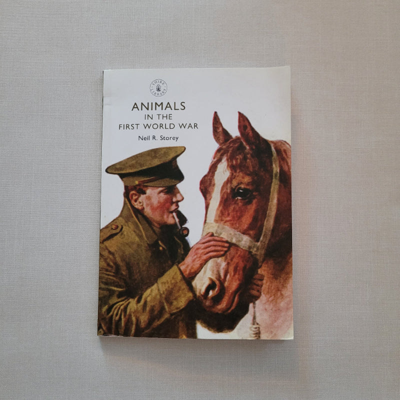 Book cover with illustration of a man and horse on a gray background