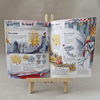 Open book with medieval-themed activities on a small wooden easel against a neutral background