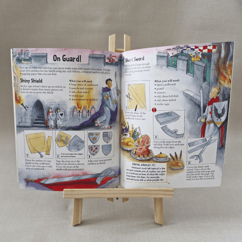 Open book with medieval-themed activities on a small wooden easel against a neutral background