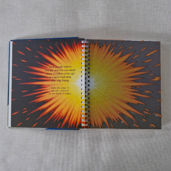 Notebook with a sunburst design on a gray fabric background