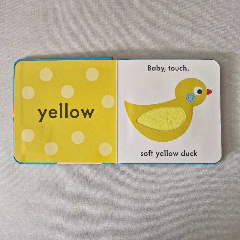 Children's book with a yellow duck illustration on a gray background