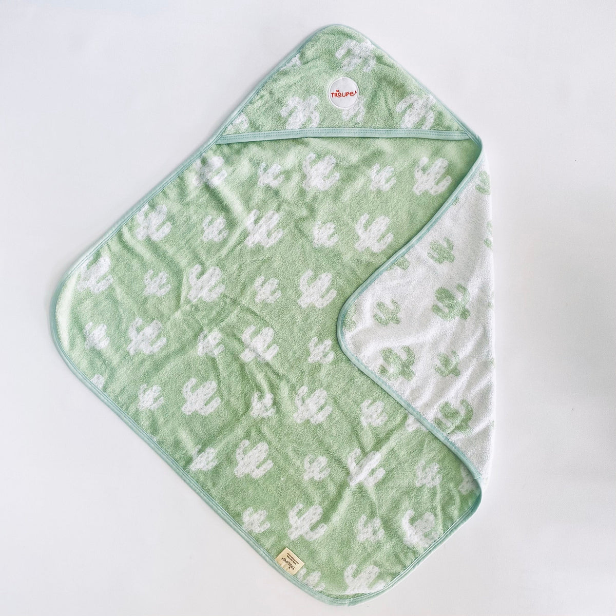Sage Cacti Baby hooded towel, lay flat on white surface