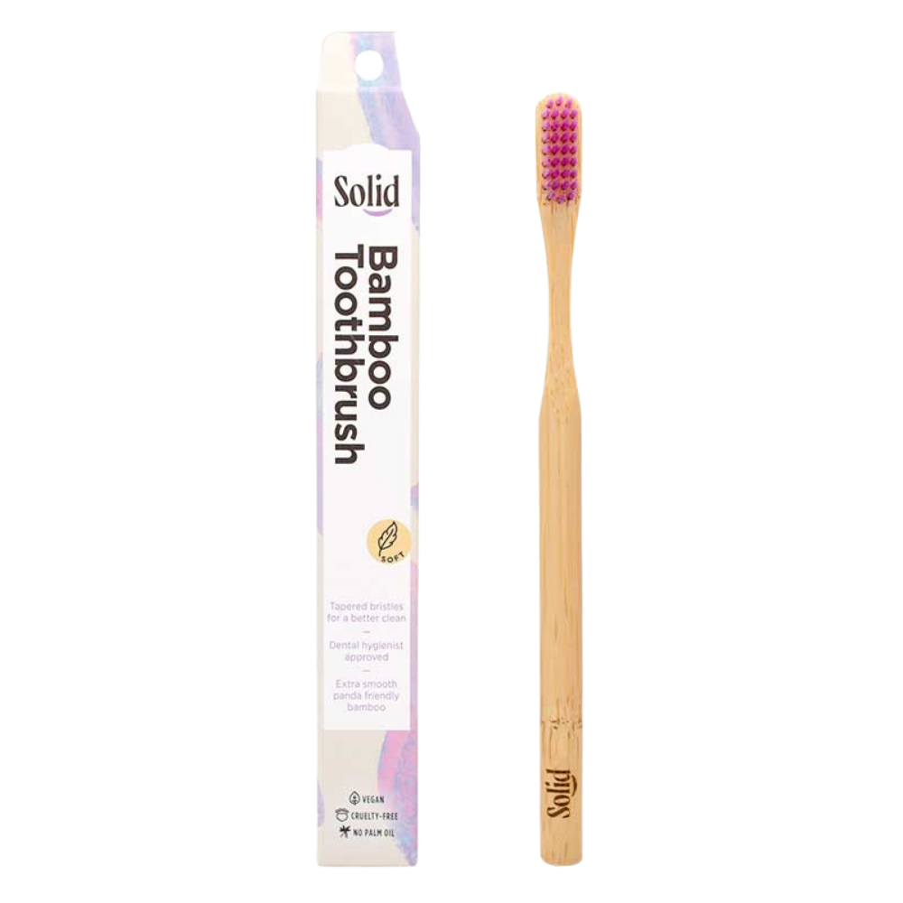 Bamboo toothbrush with packaging on a white background