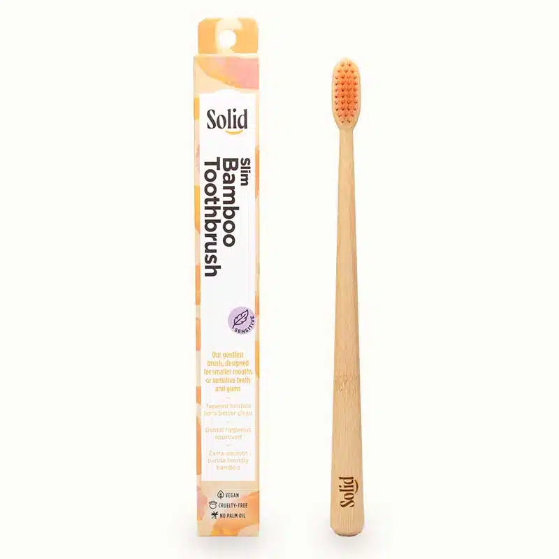Bamboo toothbrush with packaging labeled 'Solid' on a white background
