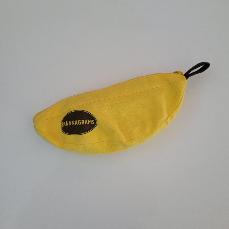 Yellow banana-shaped pouch with 'Bananagrams' logo on a white background
