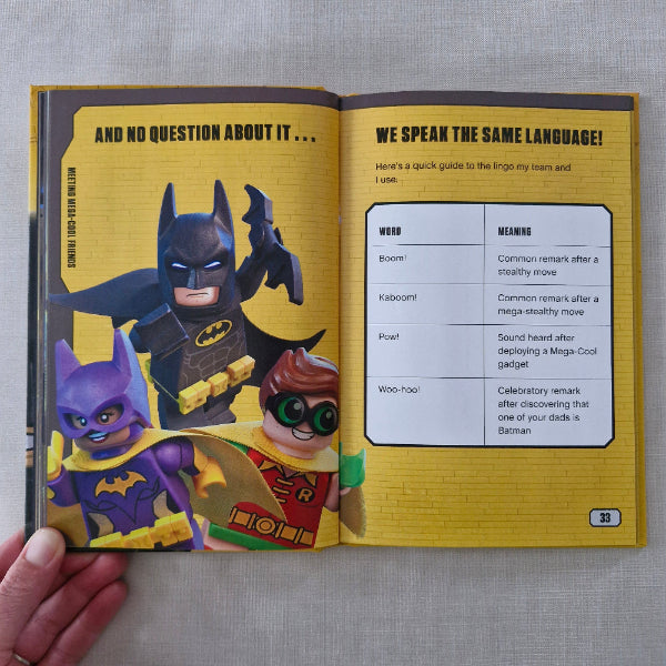 Open book with a colourful illustration of characters on a yellow background