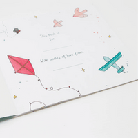 Personalized book cover with a pink kite, blue airplane, and birds on a white background.