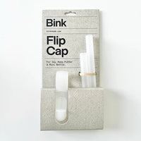 Bink Flip Cap packaging with cap and two silicone straws on a white background