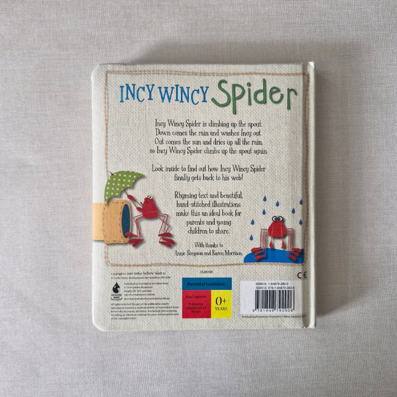Book back titled 'Incy Wincy Spider' on a gray surface