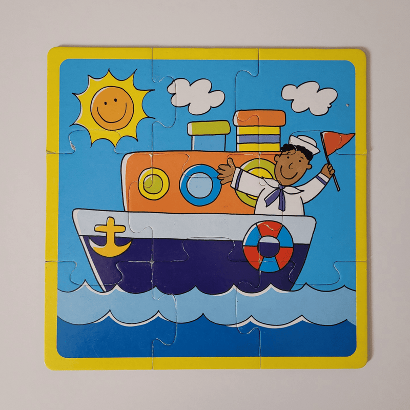 Children's puzzle with a boat and sailor design on a blue background