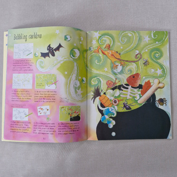 Open book with colourful illustrations on a gray background