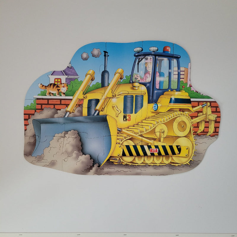 Medium size children's floor puzzle with a colourful bulldozer design on a plain background